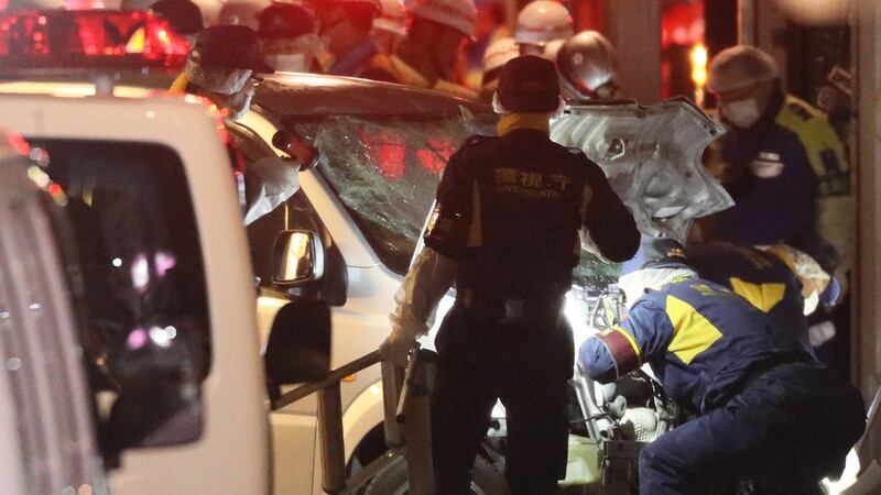 Police inspect a vehicle which was driven into crowds in Tokyo early on January 1st. Nine people were hurt, one seriously. Photograph: AFP/Getty
