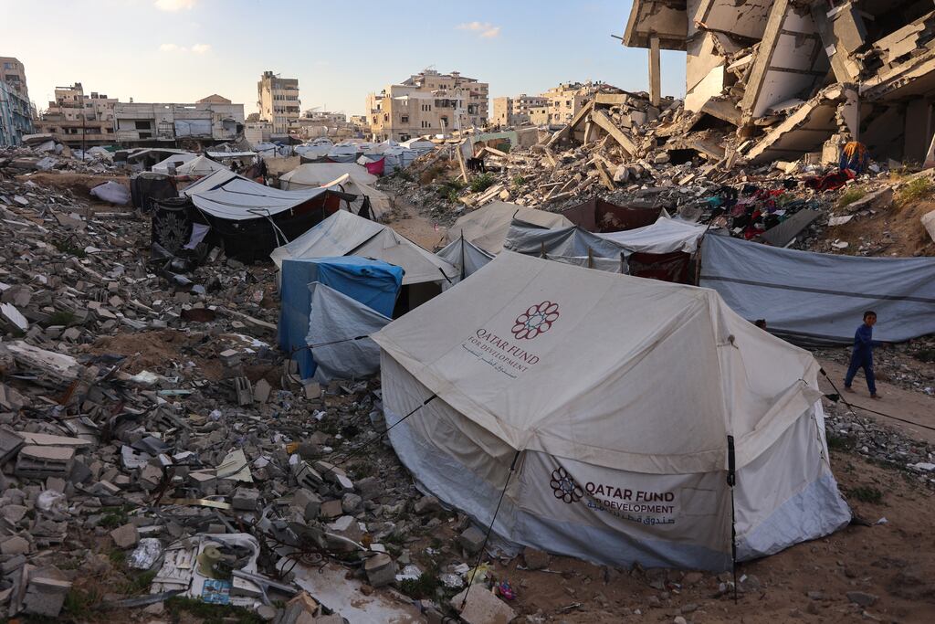 Shelters set up amid the rubble of destroyed buildings in Gaza City. Photograph: Omar Al-Qattaa/Getty Images
