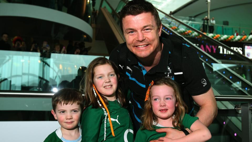 Brian O’Driscoll with his nephew Sean Kennedy (4) and his nieces Katie (7) and Aoife Kennedy (5) (right) as the Ireland team arrive at Dublin Airport. Photograph: Brian Lawless/PA Wire.