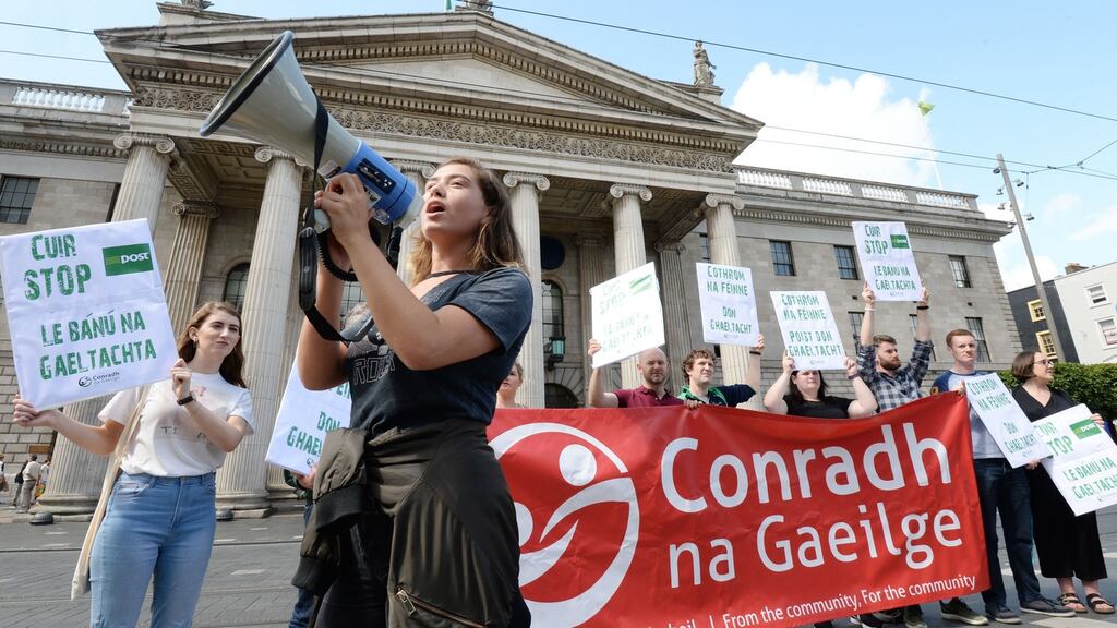Siomha Ní Ruairc with fellow members of Conradh na Gaeilge outside the GPO protesting to ensure An Post will not end services through Irish in Gaeltacht areas. Photograph: Alan Betson
