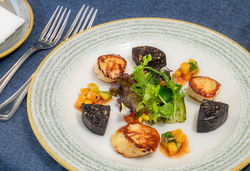 West coast scallops paired with Kelly’s black pudding, finished with pineapple and cucumber salsa, at Dining Room, Castlebar. Photograph: Michael McLaughlin