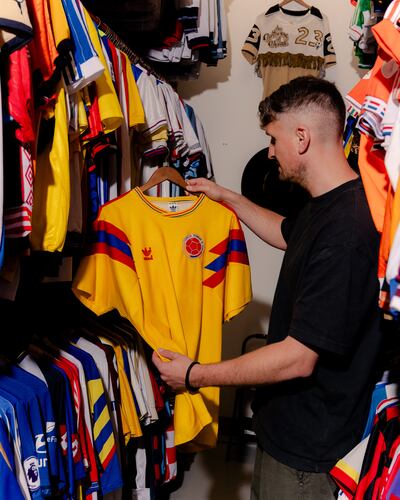 Doug Bierton holding Colombia's jersey from the 1990 World Cup. Photograph: Jack Roe/The New York Times