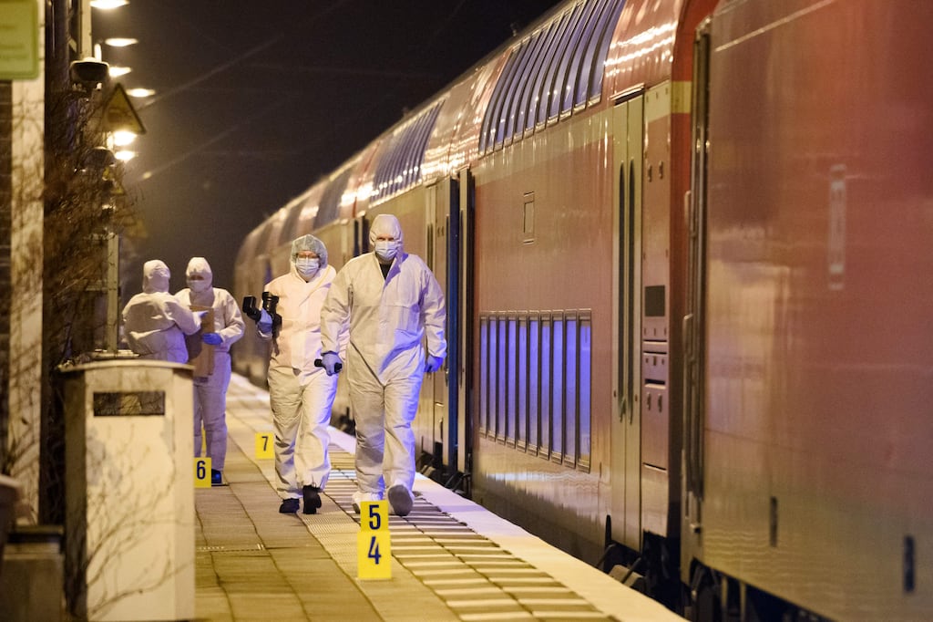 Police forensic experts at the train station in Brokstedt, northern Germany, on Wednesday after a knife attack in which two people were killed. Photograph: Gregor Fischer/AFP via Getty Images