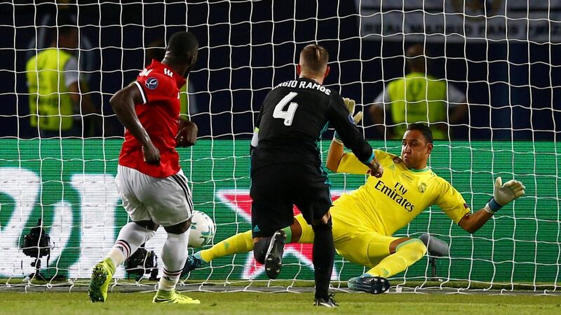 Romelu Lukaku scores for Manchester United in their Super Cup defeat to Real Madrid. Photograph: Peter Cziborra/Reuters