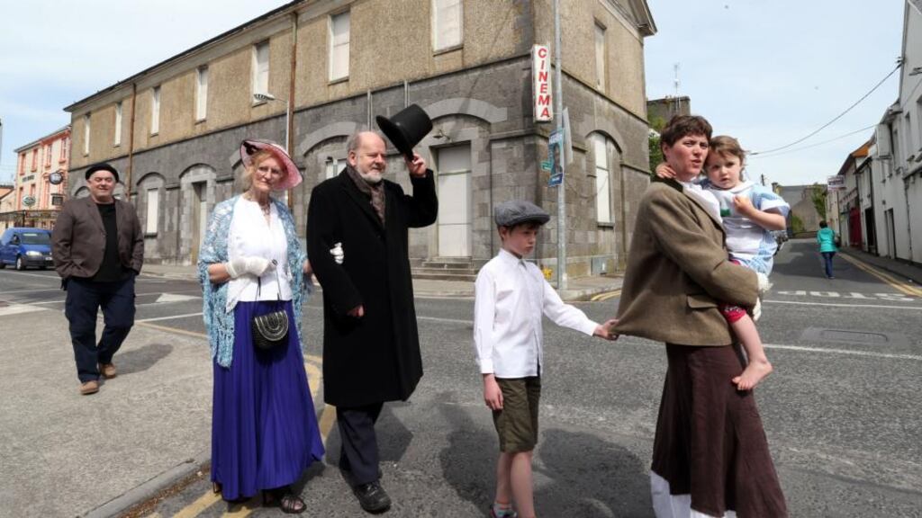 Members of Loughrea Arts, Recreation and Culture at the boarded up Loughrea Town Hall. From front: Fiona Keane of the East Galway Youth Theatre with her daughter Orlagh and son Adam, John Kelly of the Seumas O’Kelly Players (as Lord Lascelles), Mary Davison of Loughrea Active Retirement, and John Creaven of the Seumas O’Kelly Players. Photograph: Joe O’Shaughnessy