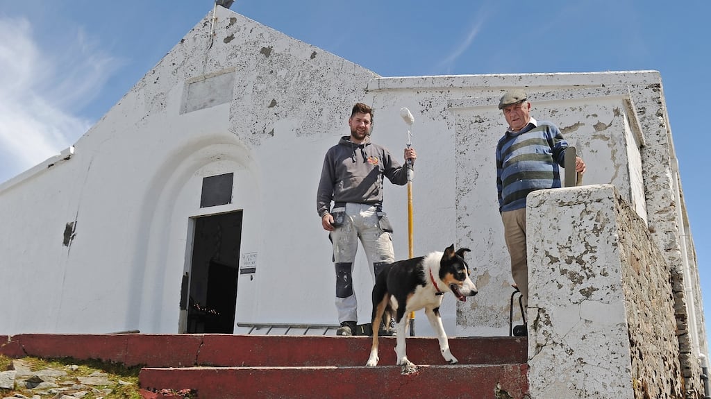 Painter James Cawley and John Cummins, the sacristan at St Patrick’s Oratory   on Croagh Patrick, looking after the maintenance and painting work. Photograph: Conor McKeown