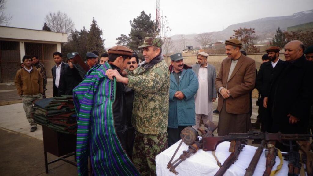Former Taliban militants attend a ceremony in Baghlan on Tuesday during which they surrender arms under a US-backed Afghan government amnesty programme. Photograph: Jawed Karger/EPA