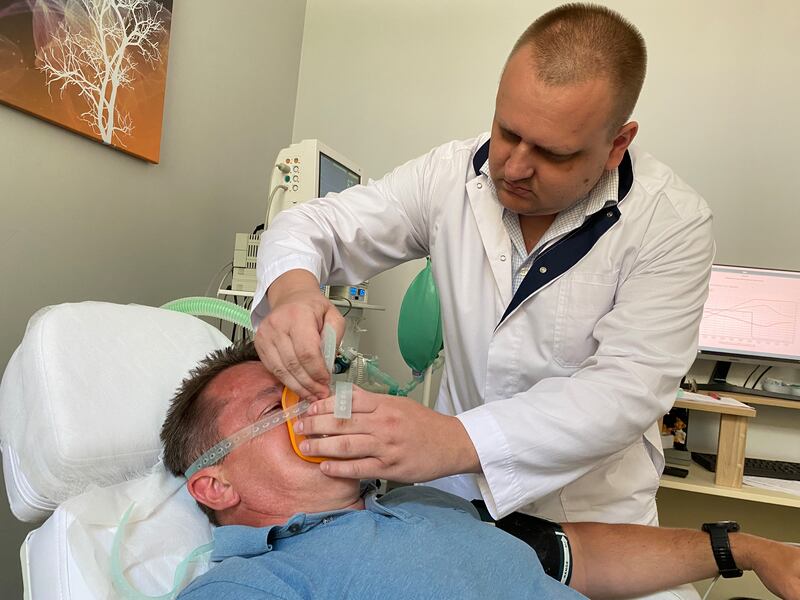 Dr Serhiy Kalynych prepares 'Grandpa Svyryd' for xenon gas treatment at the Xenium clinic. At $10,000 (€9,200) for a 2kg cannister of condensed gas, xenon is expensive.
