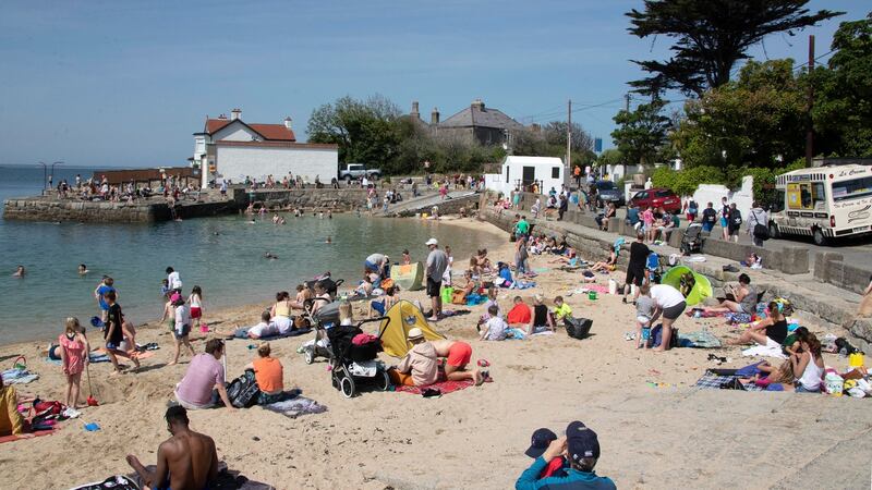 Sunbathers enjoying the fine weather at Sandycove on Thursday afternoon. Photograph: Colin Keegan, Collins Dublin