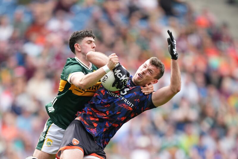 Armagh goalkeeper Ethan Rafferty is tackled by Dylan Geaney of Kerry. Photograph: James Lawlor/Inpho