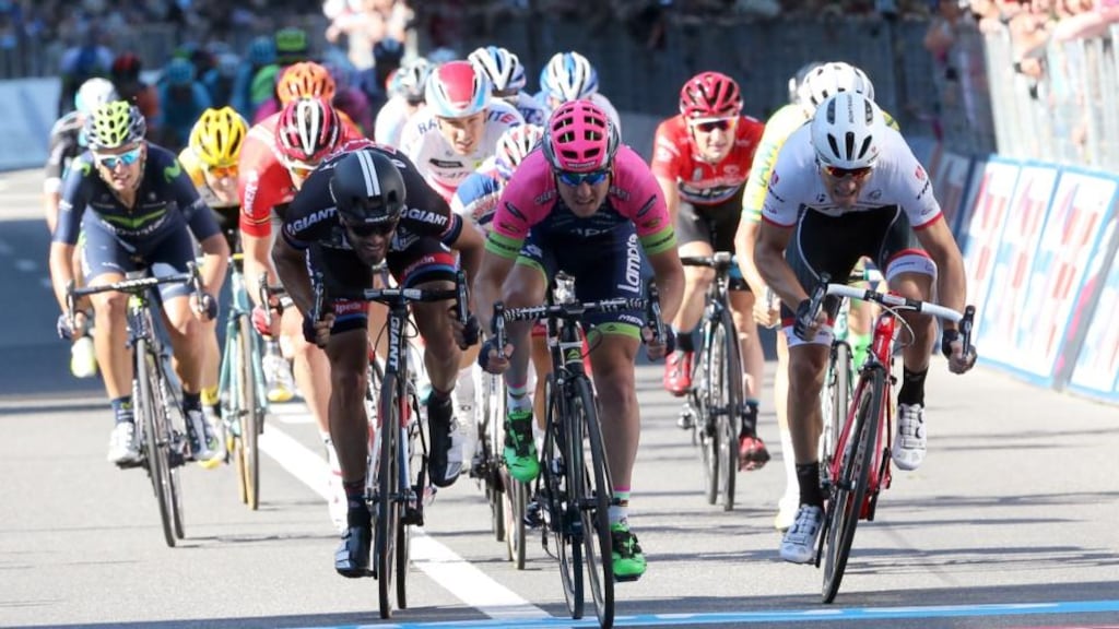 Italia rider Sacha Modolo crosses the finish line to win the 17th stage of the 98th Giro d’Italia between Tirano and Lugano. Photograph: Getty Images