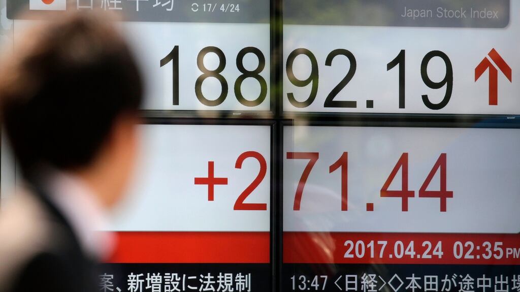 Japanese shares advanced to the highest level since March after their best week of the year, while the yen weakened for the fifth day out of six. (Photograph: KIMIMASA MAYAMA/EPA)