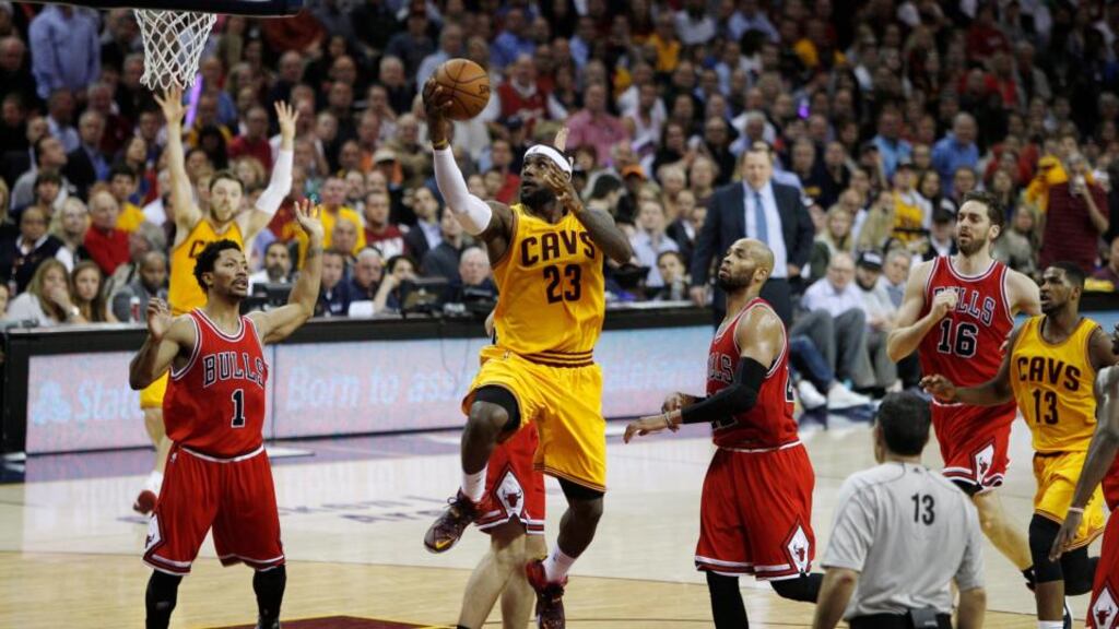 LeBron James of the Cleveland Cavaliers goes to the basket as Chicago Bulls players Taj Gibson, and Pau Gasol look on during the first half of their second round NBA Eastern Conference Playoff game at Quicken Loans Arena in Cleveland. Photo: David Maxwell/EPA