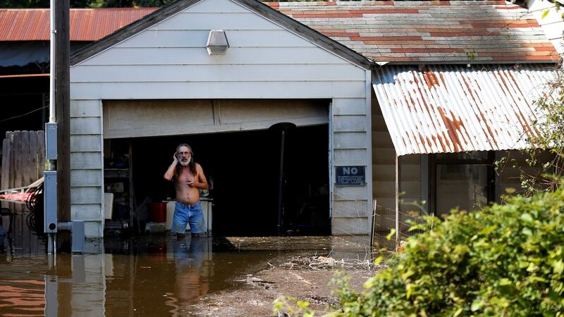 Kent Kirk looks out from his garage flooded by Tropical Storm Harvey in Rose City, Texas. Photograph: Jonathan Bachman/Reuters