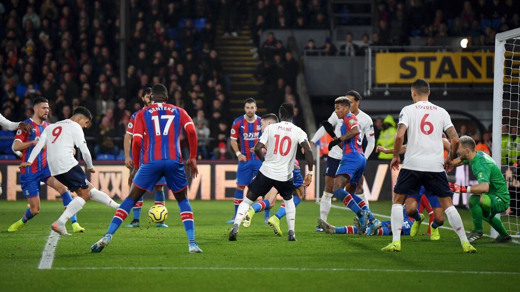 Roberto Firmino scores Liverpool’s second goal during the Premier League match against Crystal Palace at Selhurst Park. Photograph: Mike Hewitt/Getty Images