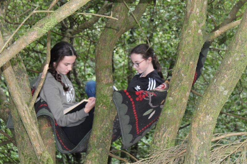 Quinn’s daughters in one of the tree-house reading rugs
