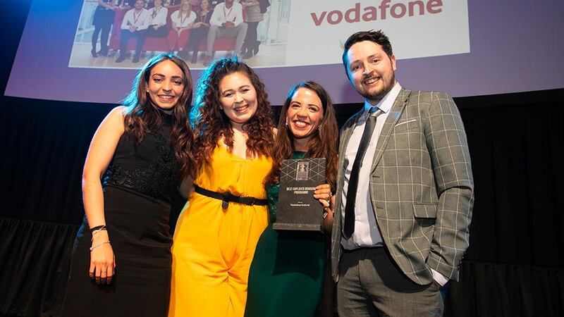 Emma Johnston, Communications Consultant, Aon, presents the Best Employer Branding Programme award to the Vodafone Ireland team.