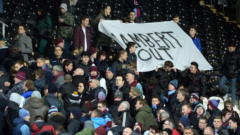 Aston Villa supporters unveil a “Lambert Out” banner at the end of the English Premier League defeat to Hull City at the KC Stadium on February 10th. Photograph: Oli Scarff / AFP / Getty Images