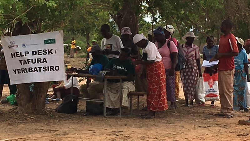 Zimbabweans queue at a pick-up station run by WFP and Goal in Mutare district. Photograph: Bill Corcoran