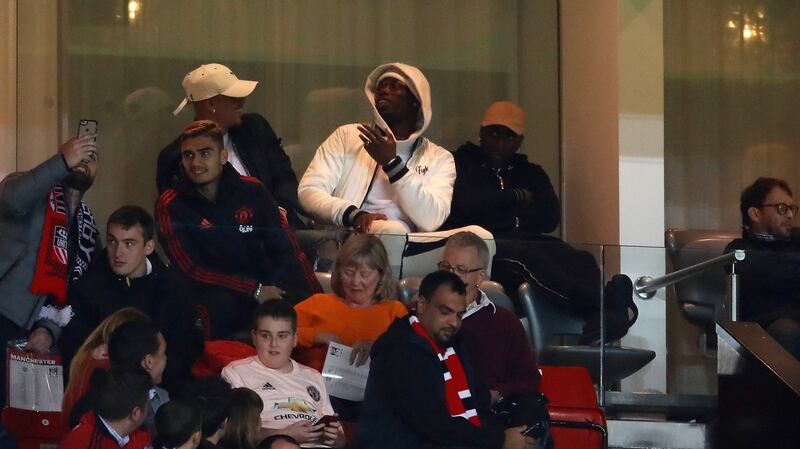 Pogba watches the match from the stands during United’s Carabao Cup loss to Derby County. Photo: Andrew Boyers/Reuters
