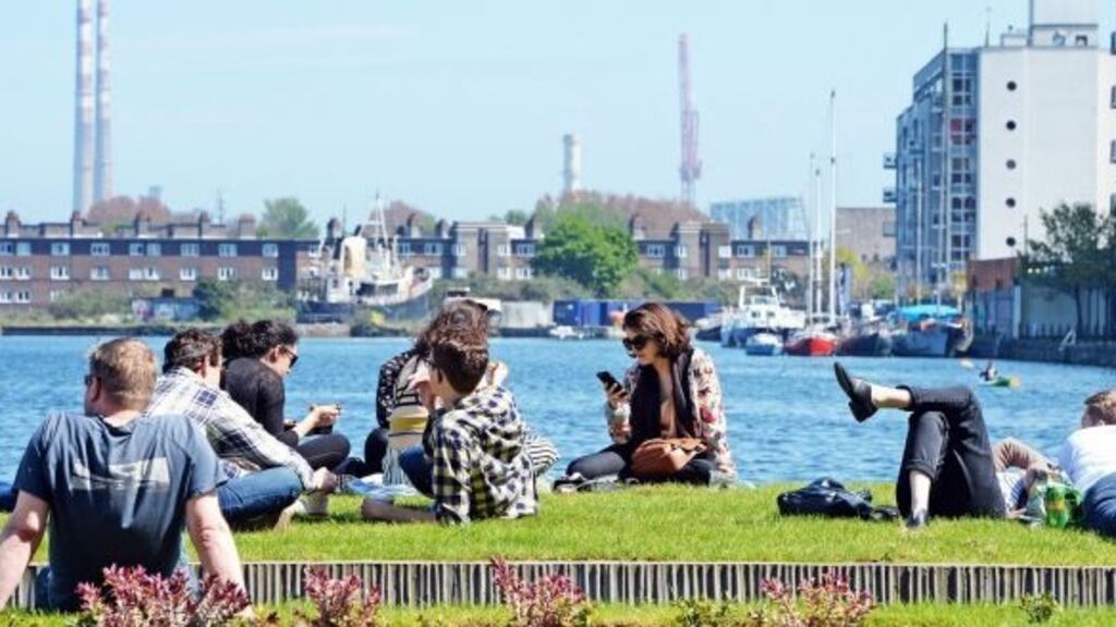 Dubliners enjoy the warm weather at Grand Canal Dock. Photograph: Eric Luke/The Irish Times/ File photo