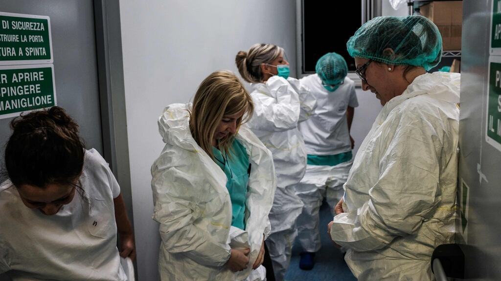 Nurses prepare for another shift at the Cremona hospital, southeast of Milan, Lombardy, during the country’s lockdown aimed at stopping the spread of the COVID-19 (new coronavirus) pandemic. Paolo Miranda/Getty Images