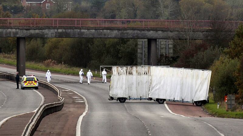 Forensic officers search the scene on the M1 motorway where prison officer David Black was shot as he drove near the town of Lurgan, Northern Ireland on November 1st, 2012. Photograph: Cathal McNaughton/Reuters
