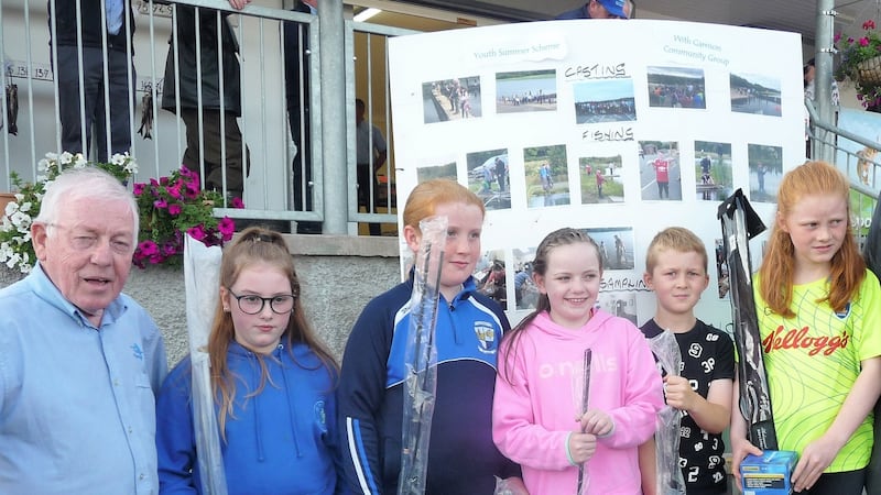 Winning teenagers who attended the youth summer scheme with committee member, Michael Gilroy.