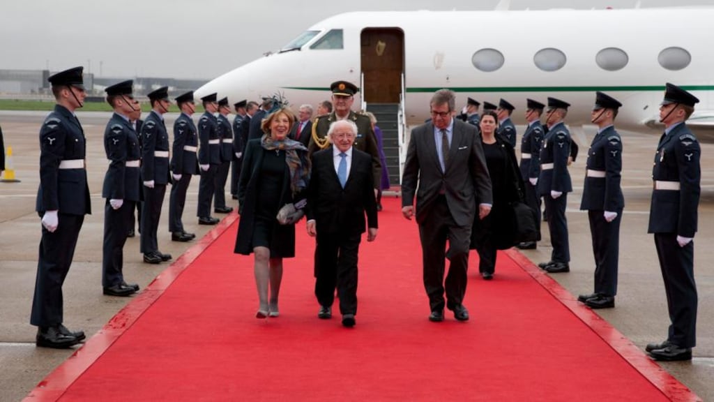 President Michael D Higgins and his wife Sabina with Viscount Henry Hood, lord-in-waiting to Queen Elizabeth, who greeted the president at Heathrow yesterday. Photograph: Chris Bellew/Fennell Photography