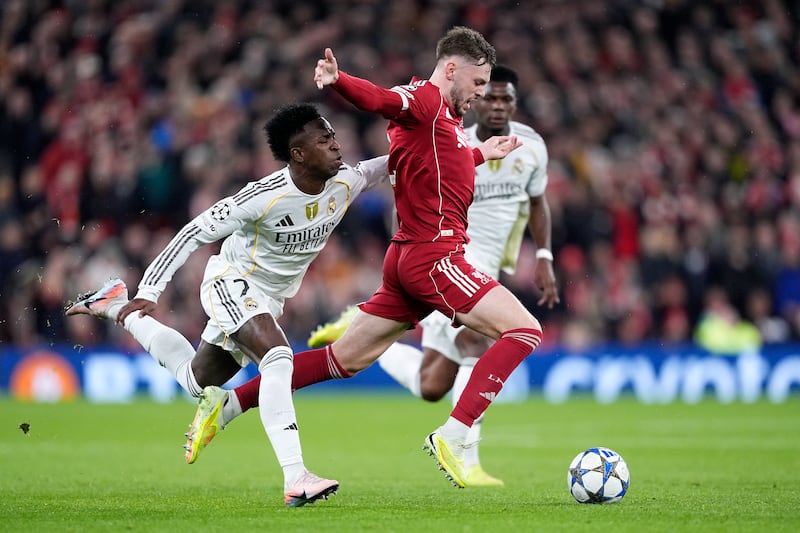 Liverpool's Conor Bradley (right) is fouled by Real Madrid's Vinicius Junior during the UEFA Champions League, league stage match at Anfield. Photograph: Peter Byrne/PA Wire