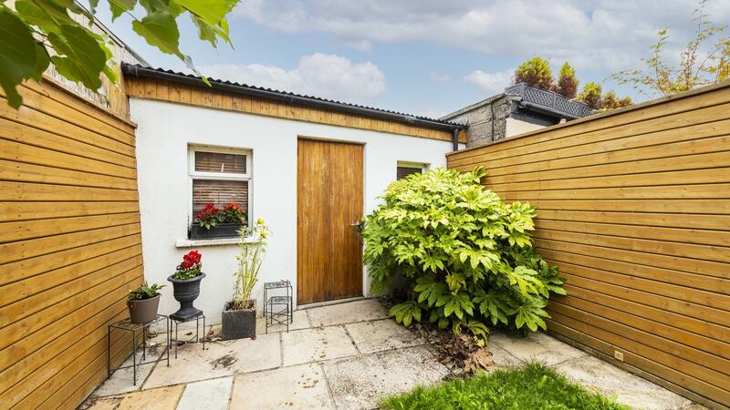 Rear garden with garage