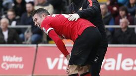 Robin van Persie leaves on crutches after Manchester United defeat
