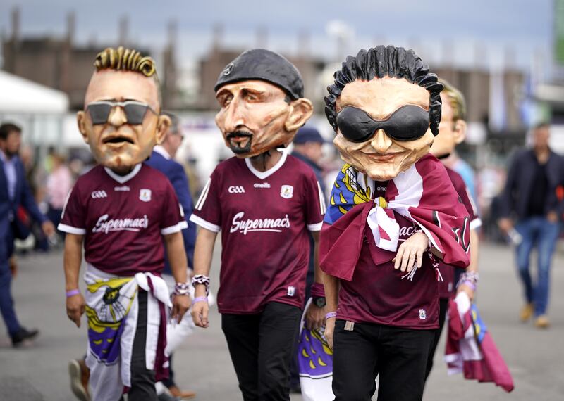 Racegoers in U2 masks during day two of the Galway Races Summer Festival. Photograph: Niall Carson