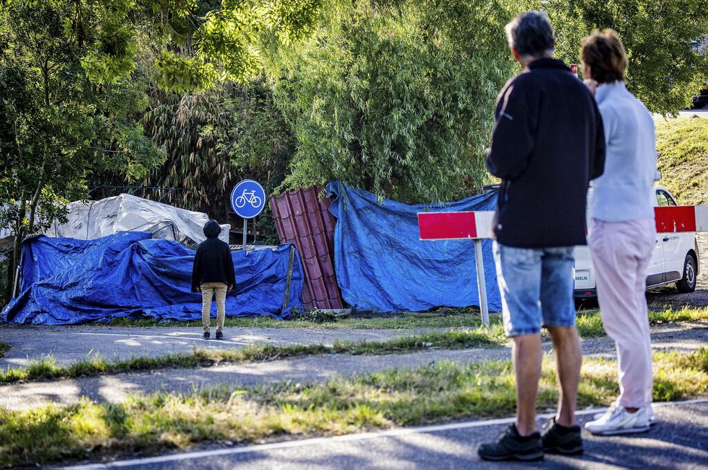 Local residents at the scene in Nieuw-Beijerland, where a truck crashed into a group of people, killing six. Photograph: JEFFREY GROENEWEG/ANP/AFP via Getty Images