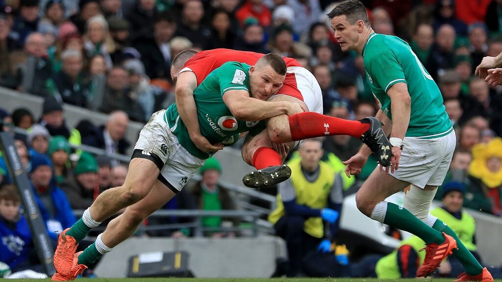 Ireland’s Andrew Conway and Johnny Sexton Wales’s Ken Owens during their Guinness Six Nations match at the Aviva Stadium, Dublin on Saturday. Photograph: Donall Farmer/PA Wire