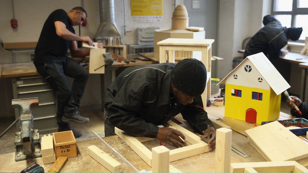Asylum seekers from Lebanon, the Gambia and Kosovo learn carpentry at the Arrivo centre in Berlin. The programme offers  exposure to a variety of trades as well as German lessons. Photograph: Getty Images