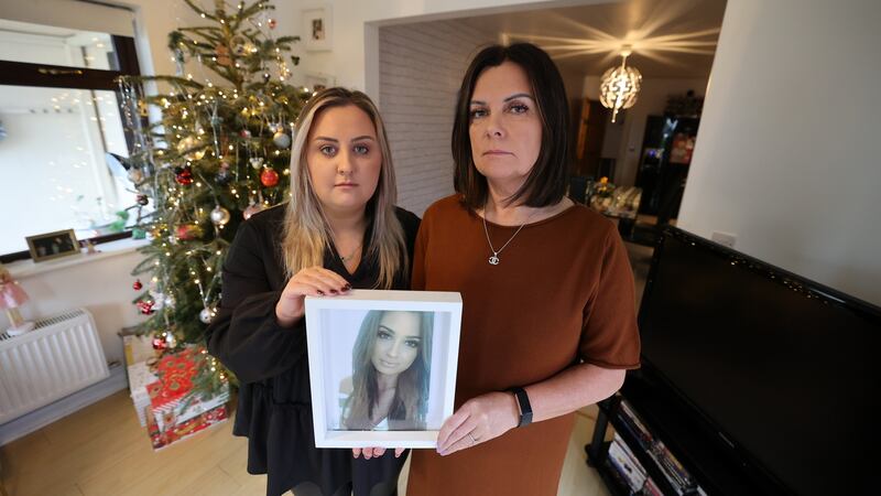 Nadine Lott’s sister Phoebe and mother Claire with a photograph of Nadine. Photograph: Nick Bradshaw