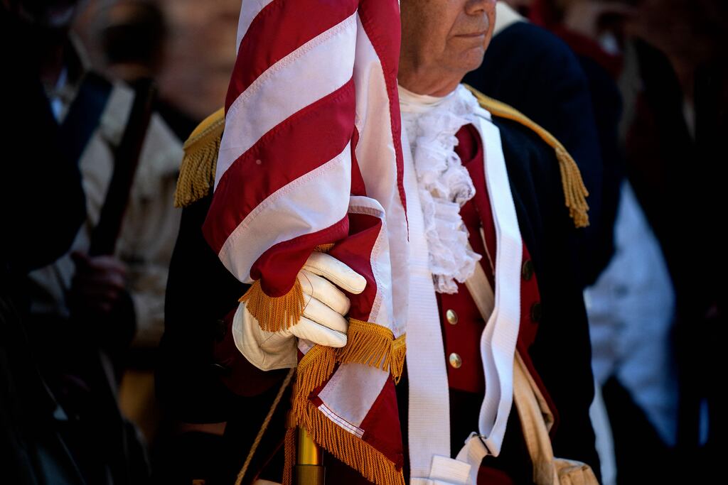 A re-enactor holds a US flag during Independence Day celebrations at George Washington's residence in Mount Vernon, Virginia, on July 4th. Photograph: Stefani Reynolds/AFP via Getty Images