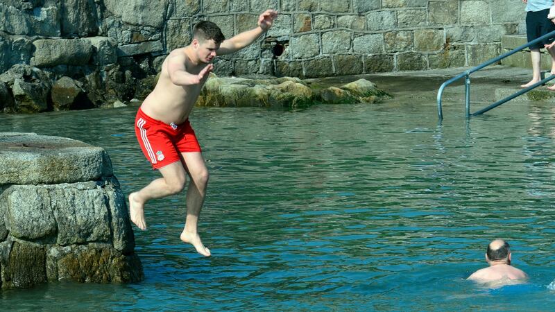 Taking the plunge in Sandycove on Monday. Photograph: Cyril Byrne/The Irish Times
