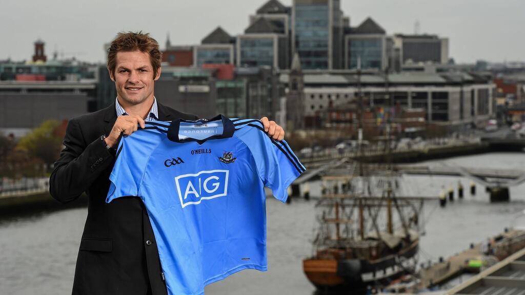 All Black legend and AIG ambassador Richie McCaw with a Dublin GAA jersey. Photograph: Stephen McCarthy/Sportsfile