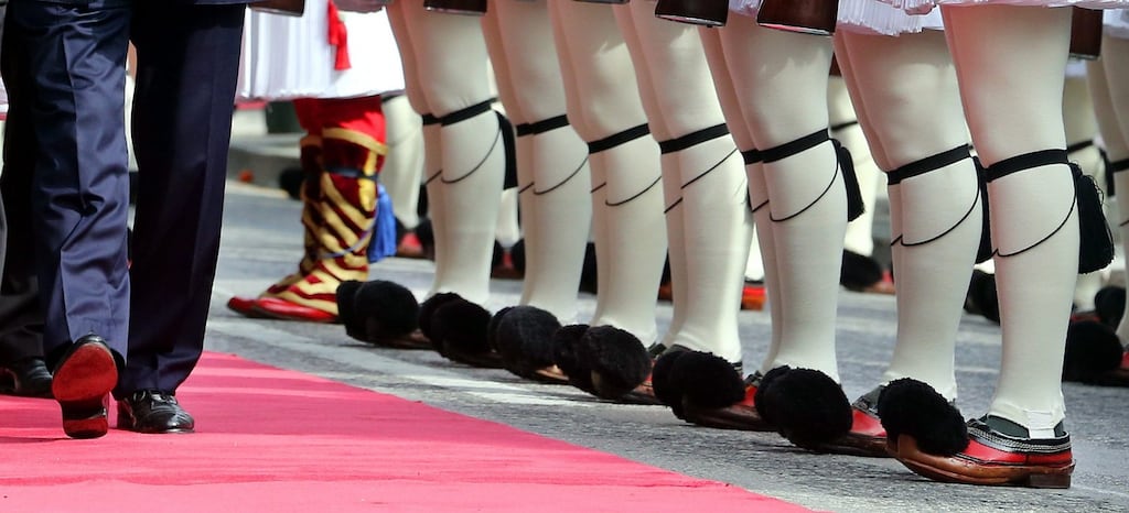 German President Joachim Gauck inspects the Evzones Presidential Guard, during the official welcome ceremony in Athens. Photograph: Wolfgang Kumm/EPA