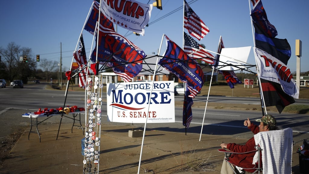 Flags in support of President Donald Trump for sale ahead of the failed campaign rally for Roy Moore, Republican candidate for Alabama. Photograph: Luke Sharrett/Bloomberg
