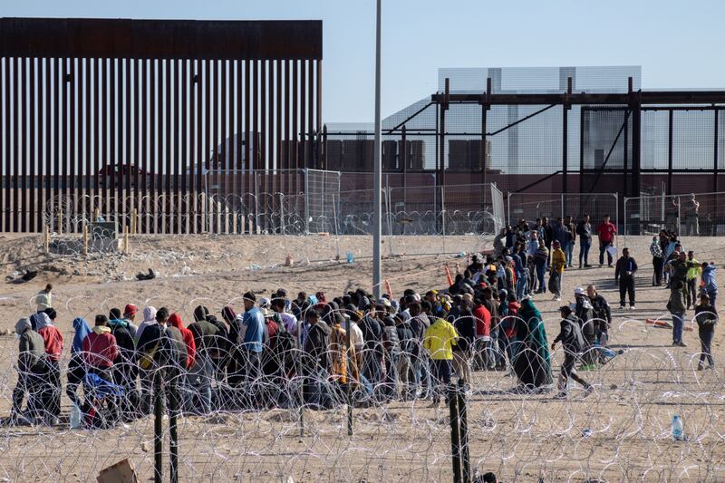 Migrants wait in line to be processed at the US-Mexico border before the lifting of Title 42 in Ciudad Juarez, Mexico, US. Photographer: David Peinado/Bloomberg