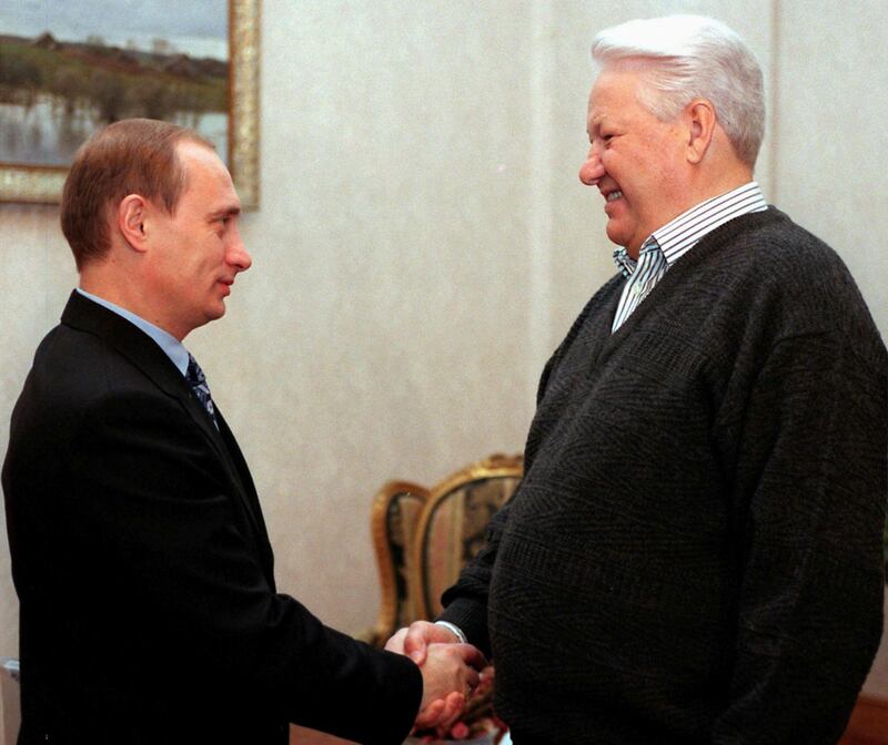 Russian president Boris Yeltsin shakes hands with prime minister Vladimir Putin during their meeting at the presidential residence Gorky-9 outside Moscow, November 1999