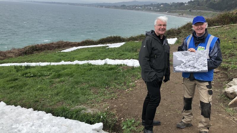 Michael Kennedy and Des Burke-Kennedy with Eileen de colgan’s photograph at Hawk Cliff