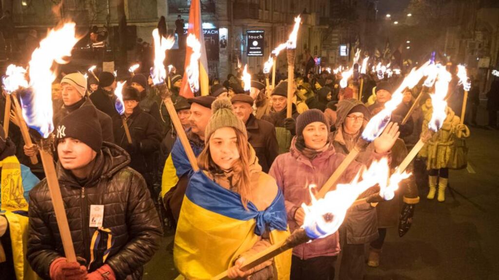Activists of the Svoboda (Freedom) Ukrainian nationalist party hold torches as they take part in a rally to mark the 105th year since the birth of Stepan Bandera, one of the founders of the Organization of Ukrainian Nationalists (OUN), in Kiev on January 1st. Photograph: Gleb Garanich /Reuters
