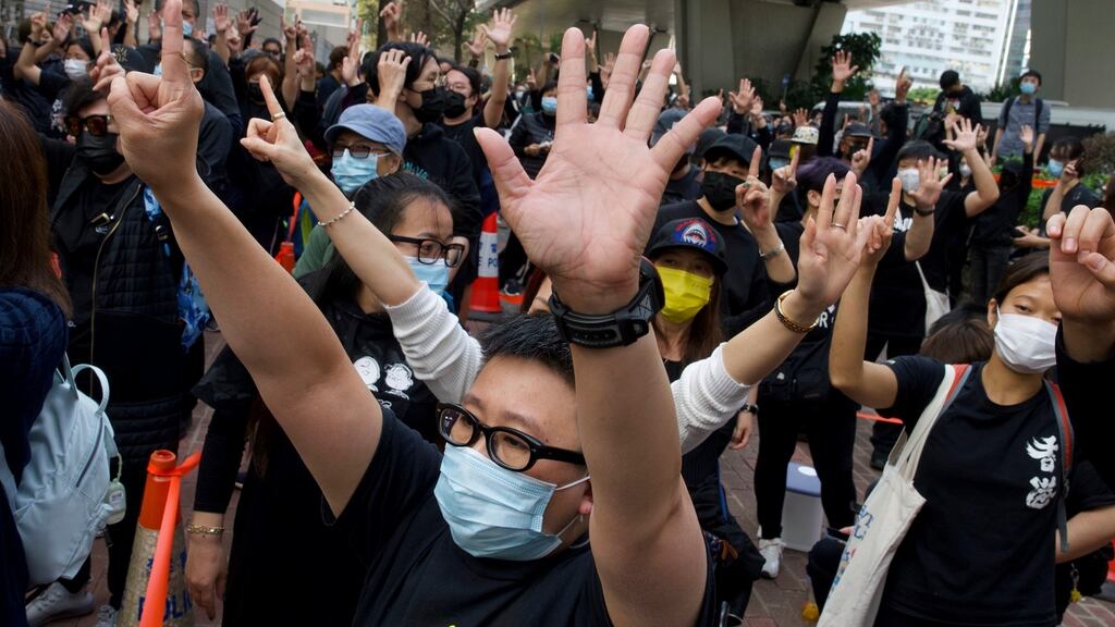 Supporters of 47 detained pro-democracy activists outside court in Hong Kong on Monday. Photograph: Vincent Yu/AP