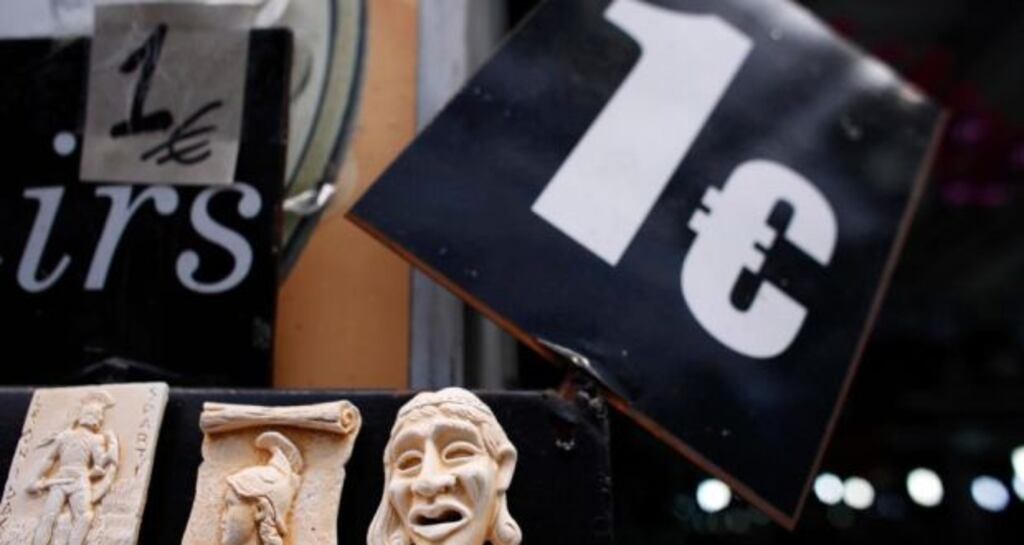 Ancient Greece themed fridge magnets sits for sale beside a one euro price sign at a euro store in Athens. (Photograph: Kostas Tsironis/Bloomberg)