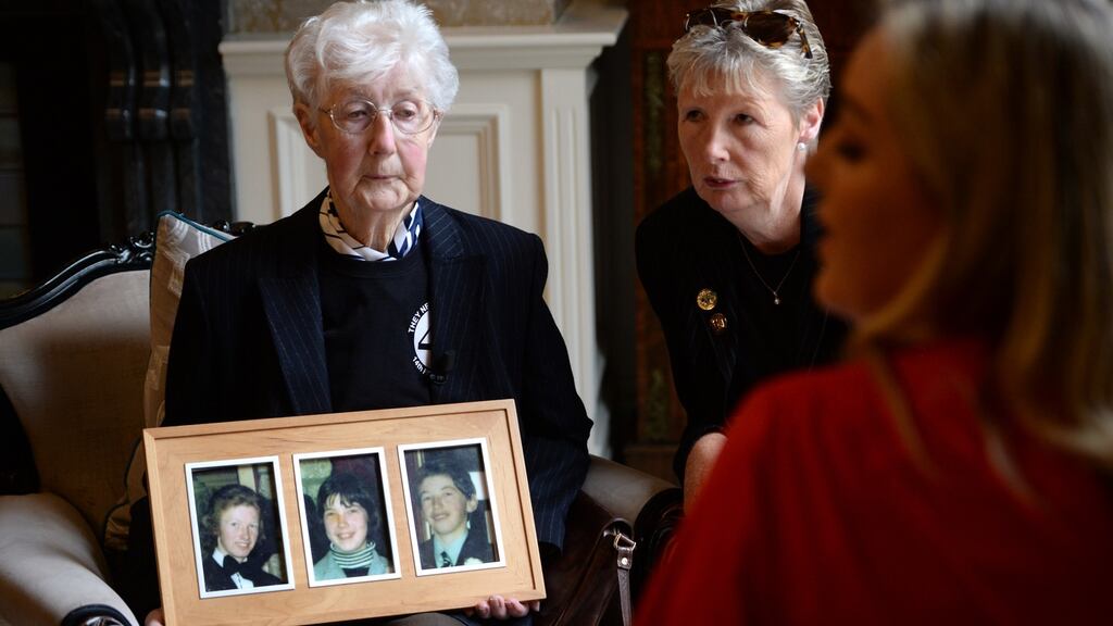 Bridget McDermott with her daughter June, holding a photograph of children William, Marcella and George, as Stardust fire victims’ families gathered at a press conference following the announcement of a new inquest into the deaths of 48 young people in the 1981 nightclub disaster. Photograph: Dara Mac Dónaill/The Irish Times