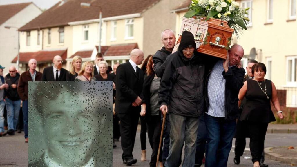 Friends and family carry the remains Seamus Wright to his funeral Mass in St Agnes’ Church in Belfast on Tuesday. The inset is a picture of Seamus Wright which was placed on his coffin. Photograph: Reuters